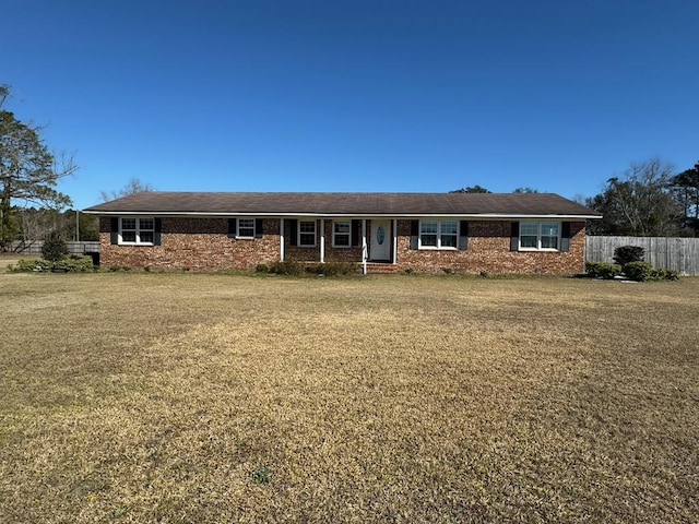 single story home with a front yard