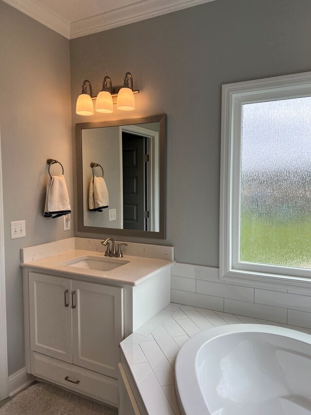 bathroom featuring crown molding and vanity