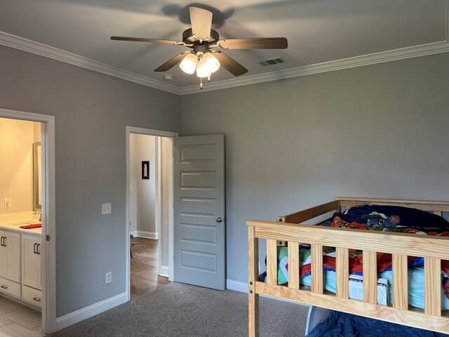 unfurnished bedroom with light colored carpet, ceiling fan, crown molding, sink, and connected bathroom