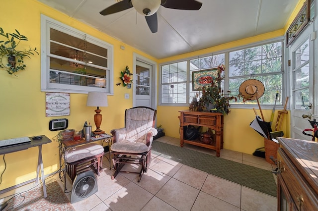 sunroom with a wealth of natural light and ceiling fan