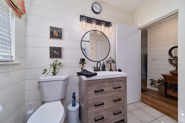 bathroom featuring vanity, toilet, and hardwood / wood-style floors