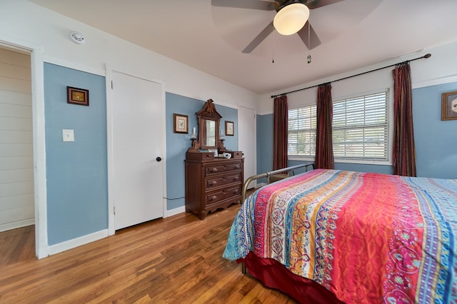 bedroom featuring wood-type flooring and ceiling fan