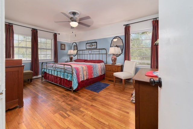 bedroom with hardwood / wood-style flooring and ceiling fan