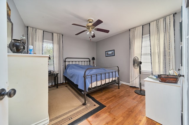 bedroom featuring ceiling fan and hardwood / wood-style floors