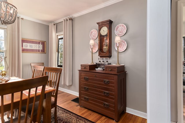 interior space with crown molding and light wood-type flooring