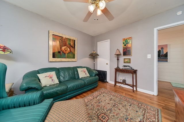 living room with hardwood / wood-style floors and ceiling fan