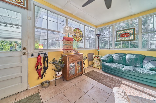 sunroom / solarium with ceiling fan and a healthy amount of sunlight