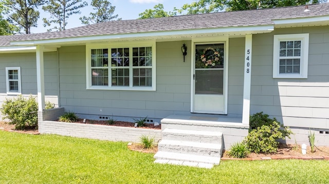 5408 S Camellia Dr, Valdosta, GA 31601 - view of exterior entry with crawl space, a yard, roof with shingles, and covered porch