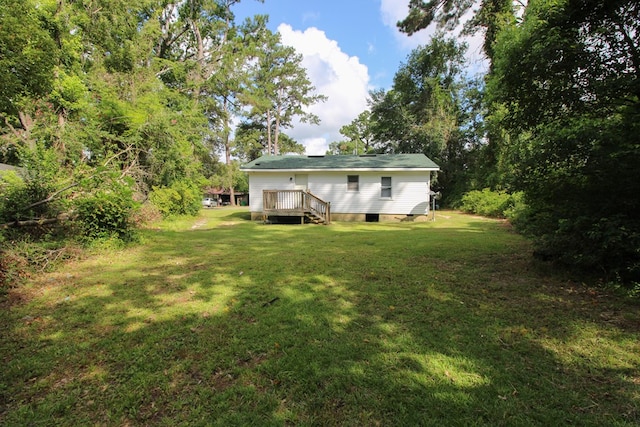 1115 Albert Rd, Valdosta, GA 31601 - back of property featuring a deck and a lawn