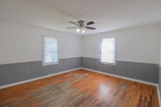 1115 Albert Rd, Valdosta, GA 31601 - spare room featuring hardwood / wood-style flooring, wainscoting, and a ceiling fan