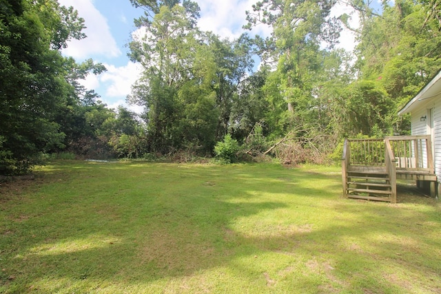1115 Albert Rd, Valdosta, GA 31601 - view of grassy yard featuring a wooden deck