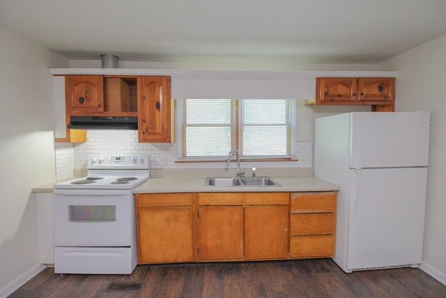 1115 Albert Rd, Valdosta, GA 31601 - kitchen with white appliances, under cabinet range hood, tasteful backsplash, and light countertops