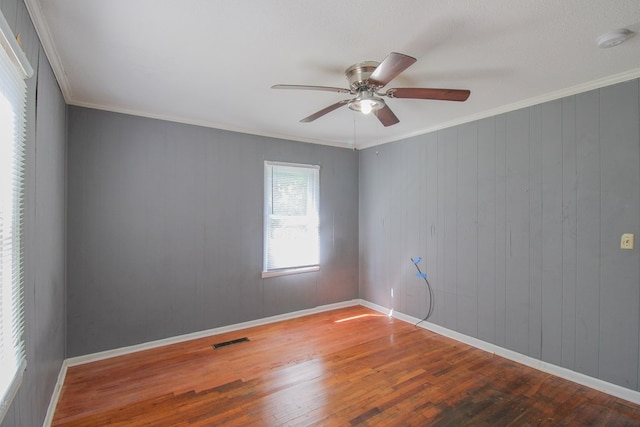 1115 Albert Rd, Valdosta, GA 31601 - empty room with a smoke detector, wood finished floors, ceiling fan, and ornamental molding
