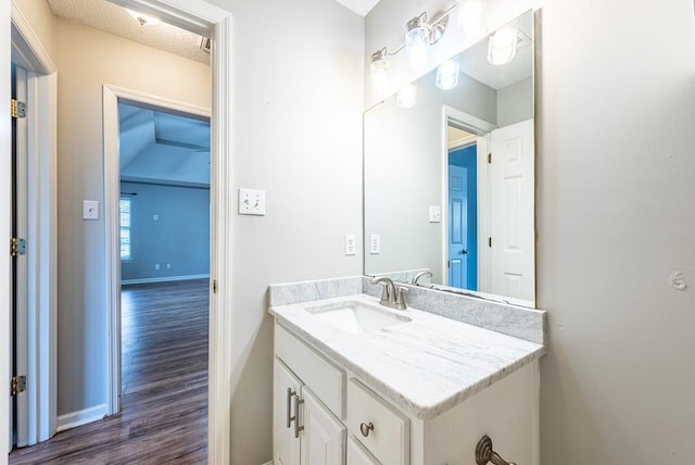 bathroom featuring vanity and hardwood / wood-style flooring