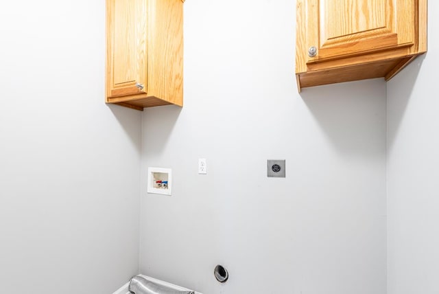 laundry area with washer hookup, electric dryer hookup, and cabinets