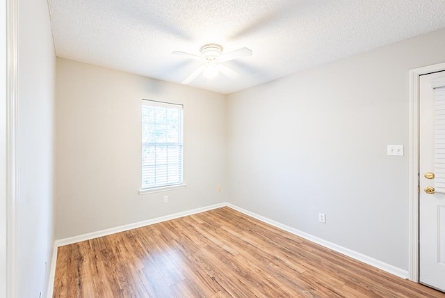 unfurnished room with hardwood / wood-style floors, a textured ceiling, and ceiling fan