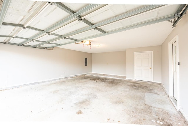 garage featuring electric panel and a garage door opener