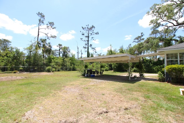 view of yard featuring a carport