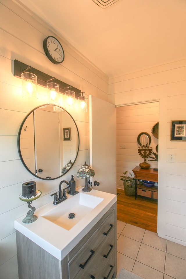 bathroom featuring tile patterned flooring and vanity