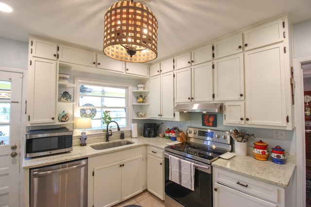 kitchen with open shelves, a sink, under cabinet range hood, stainless steel appliances, and white cabinetry