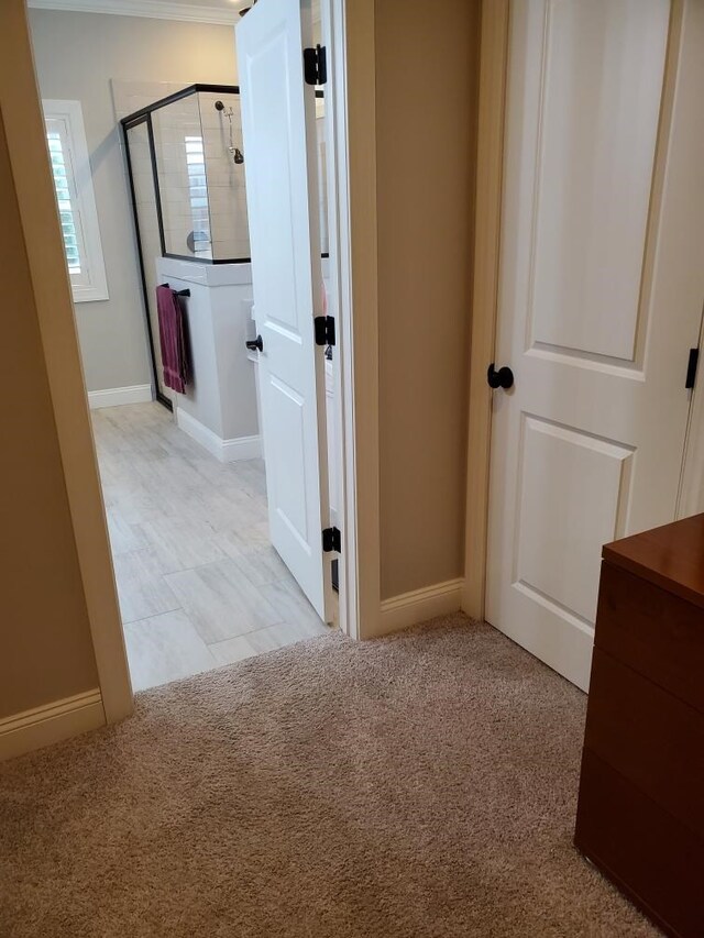 bathroom with wood-type flooring and a tub to relax in