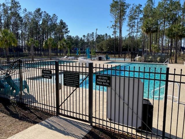 view of pool featuring a patio