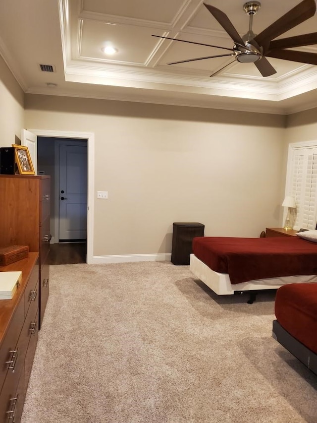 bedroom with ornamental molding, coffered ceiling, and light carpet