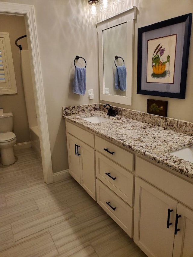 full bathroom with vanity, shower / bathing tub combination, and toilet