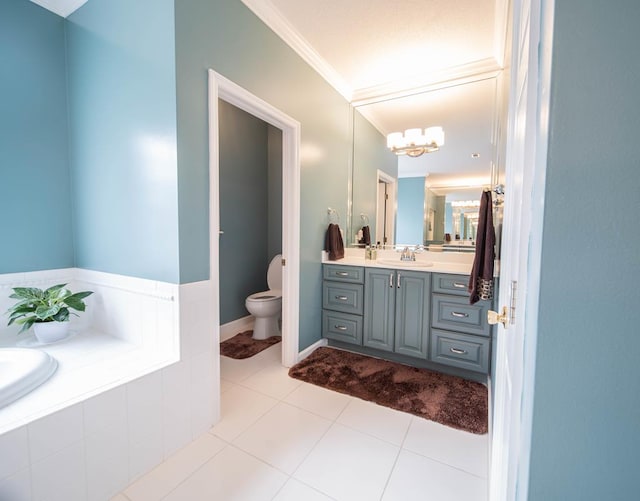 bathroom featuring vanity, tile patterned floors, crown molding, toilet, and tiled bath