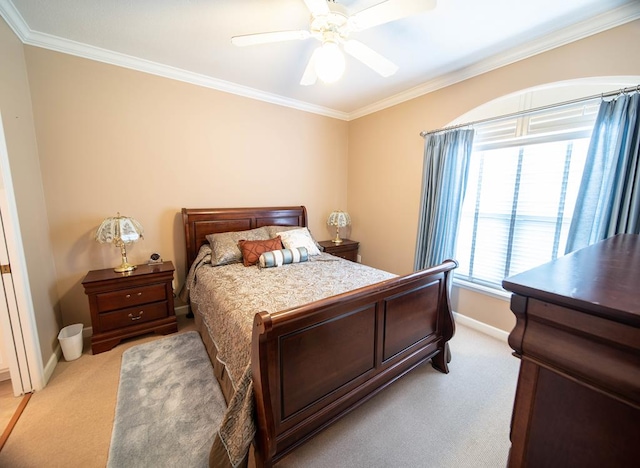 bedroom featuring ceiling fan, light colored carpet, and crown molding