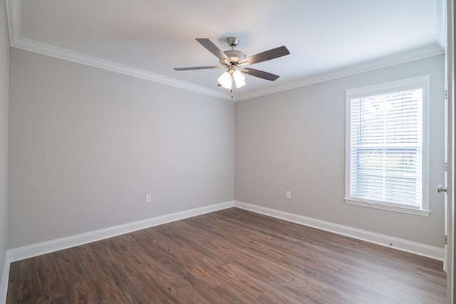 empty room with ceiling fan, dark hardwood / wood-style floors, and ornamental molding