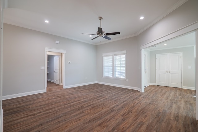 unfurnished room featuring ceiling fan, dark hardwood / wood-style flooring, and crown molding