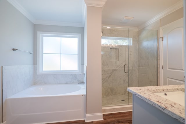 bathroom featuring hardwood / wood-style floors, vanity, crown molding, and separate shower and tub