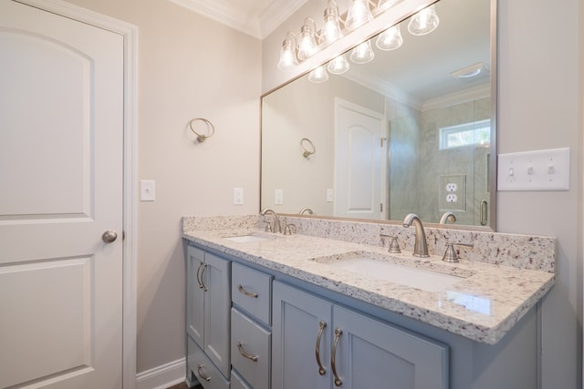 bathroom featuring ornamental molding and vanity