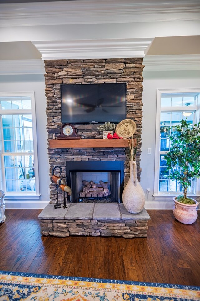 5643 Timberwind Cir, Lake Park, GA 31636 - detailed view of wood finished floors, a stone fireplace, and ornamental molding