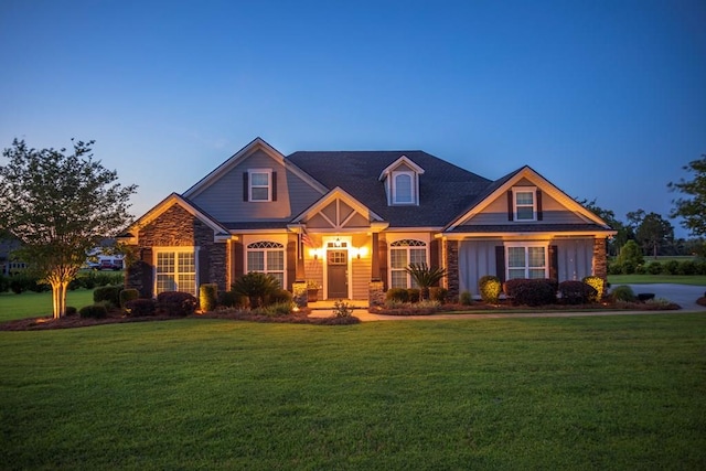 5643 Timberwind Cir, Lake Park, GA 31636 - view of front of house with a front lawn, stone siding, and board and batten siding