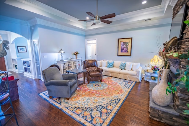 5643 Timberwind Cir, Lake Park, GA 31636 - living area with arched walkways, ceiling fan, wood finished floors, a tray ceiling, and ornamental molding