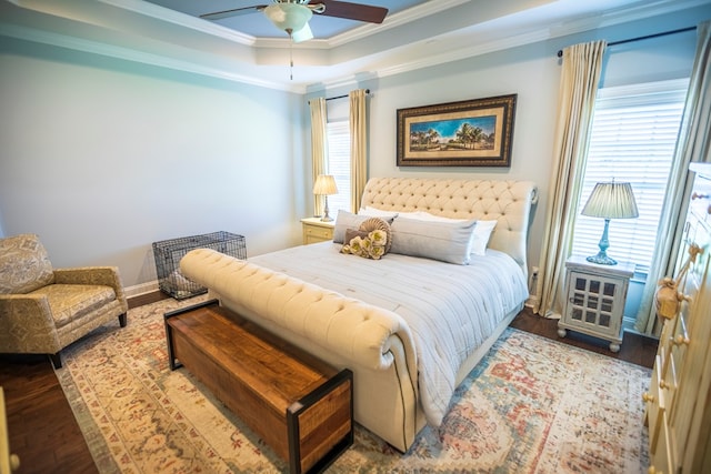 5643 Timberwind Cir, Lake Park, GA 31636 - bedroom featuring ornamental molding, wood finished floors, a raised ceiling, and ceiling fan