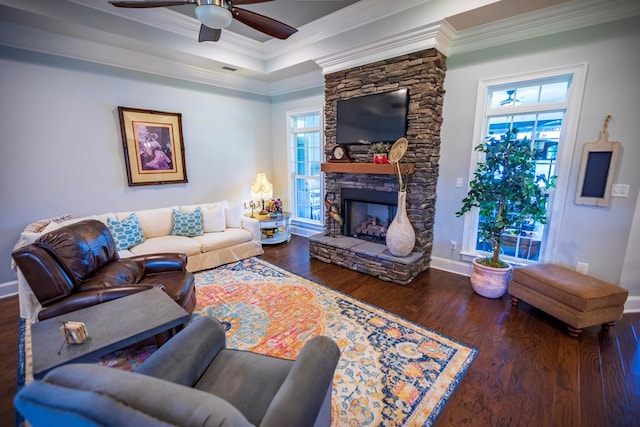 5643 Timberwind Cir, Lake Park, GA 31636 - living room featuring crown molding, a ceiling fan, wood finished floors, baseboards, and a stone fireplace