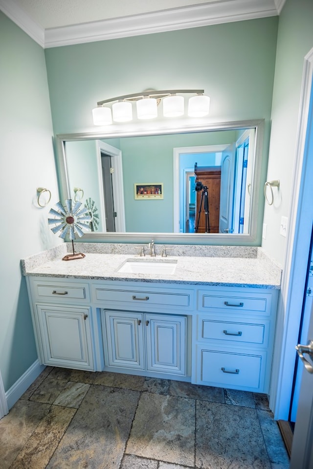 5643 Timberwind Cir, Lake Park, GA 31636 - bathroom featuring crown molding, vanity, and baseboards