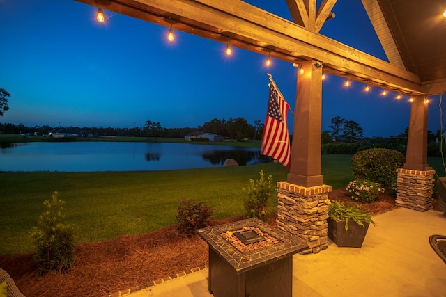 5643 Timberwind Cir, Lake Park, GA 31636 - patio at night with a yard and a water view