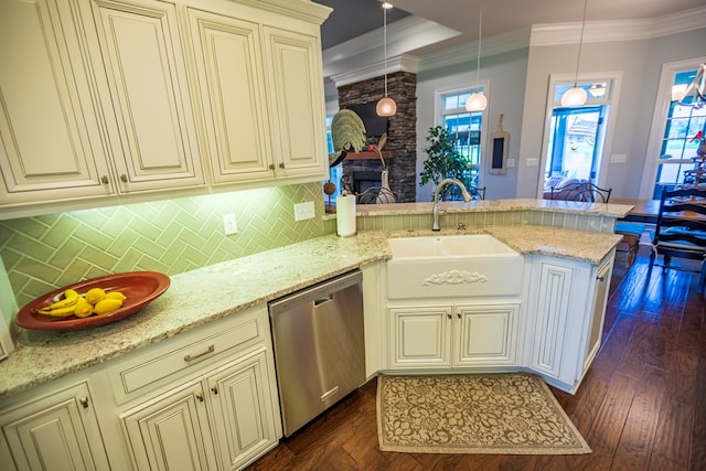 5643 Timberwind Cir, Lake Park, GA 31636 - kitchen with stainless steel dishwasher, cream cabinetry, a sink, a peninsula, and backsplash