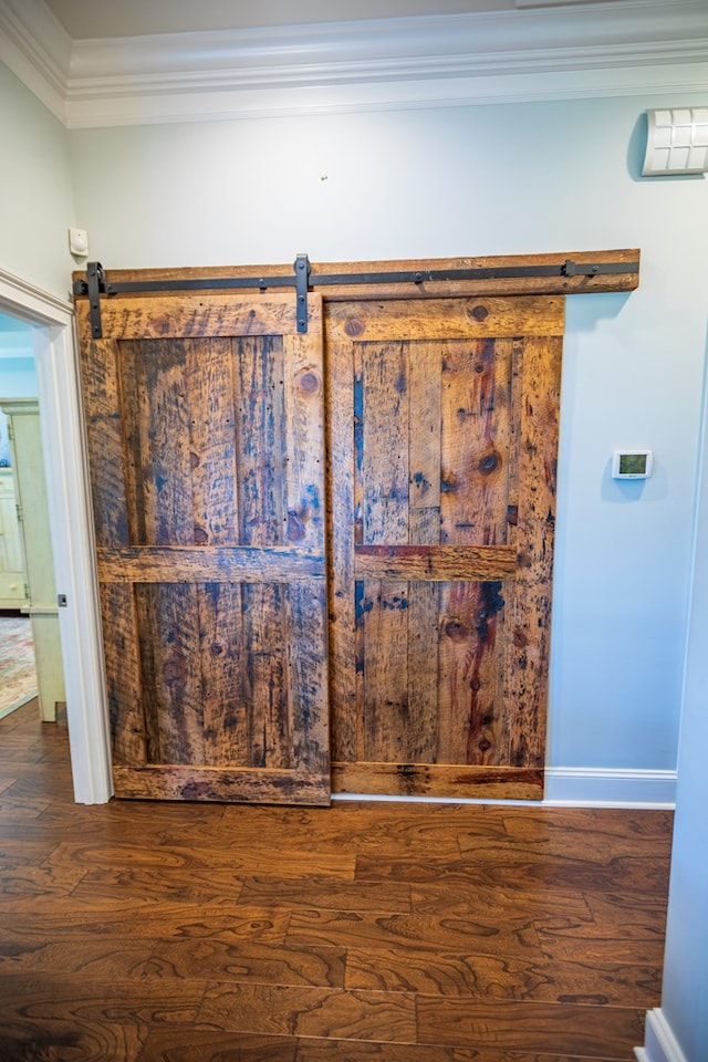 5643 Timberwind Cir, Lake Park, GA 31636 - detailed view of ornamental molding, wood finished floors, a barn door, and baseboards