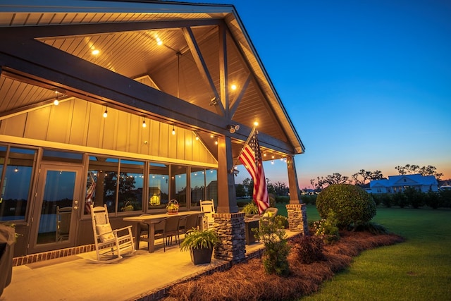 5643 Timberwind Cir, Lake Park, GA 31636 - patio terrace at dusk featuring a yard