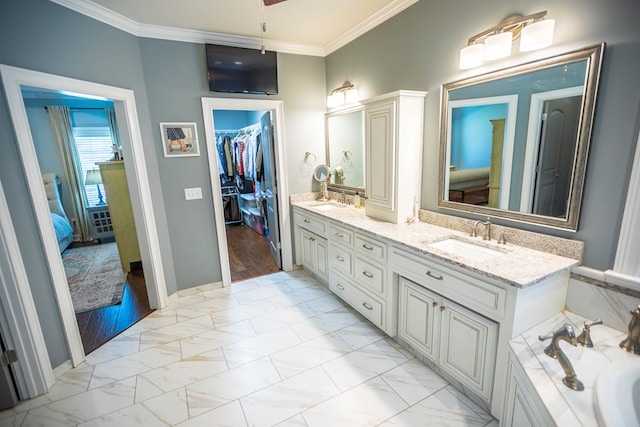 5643 Timberwind Cir, Lake Park, GA 31636 - ensuite bathroom featuring crown molding, double vanity, marble finish floors, a spacious closet, and baseboards