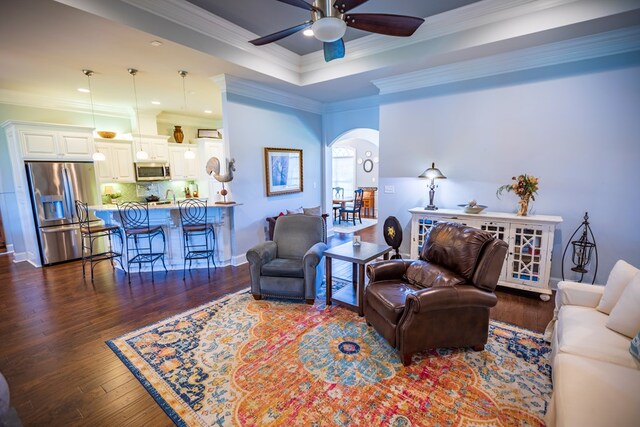 5643 Timberwind Cir, Lake Park, GA 31636 - living room featuring arched walkways, ceiling fan, crown molding, dark wood-type flooring, and recessed lighting