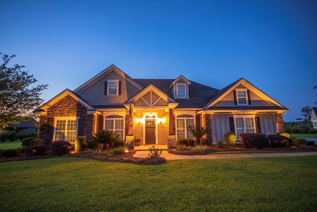 5643 Timberwind Cir, Lake Park, GA 31636 - craftsman inspired home featuring stone siding, a front lawn, and board and batten siding