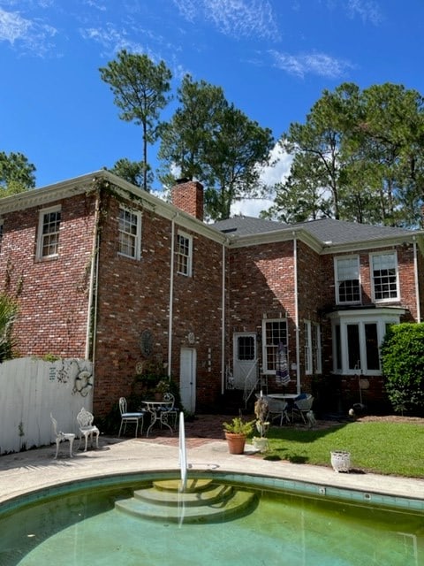 rear view of property featuring a patio