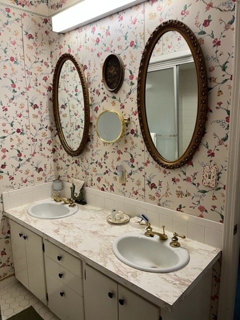 bathroom featuring tile patterned flooring and vanity