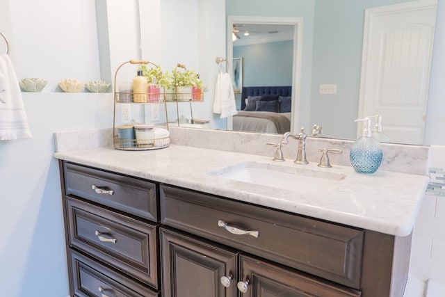 bathroom featuring connected bathroom and vanity